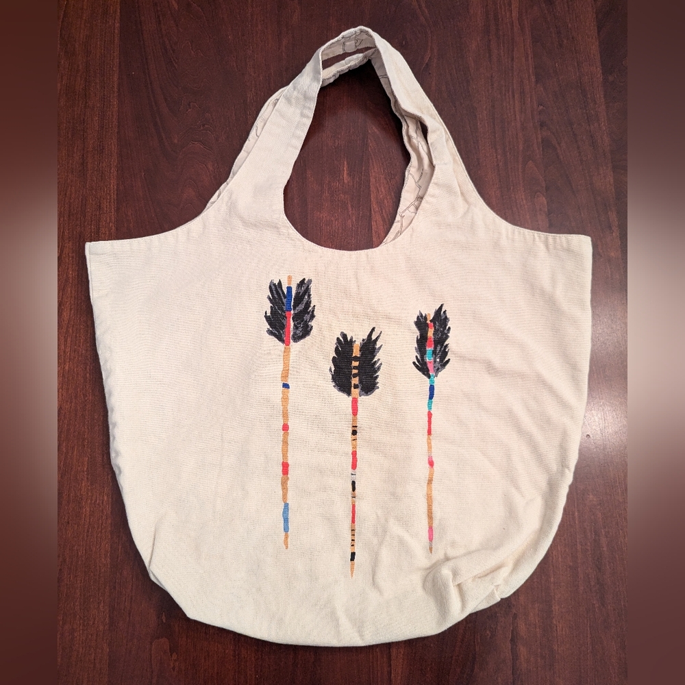 TOMS reusable packable tote bag with arrow design